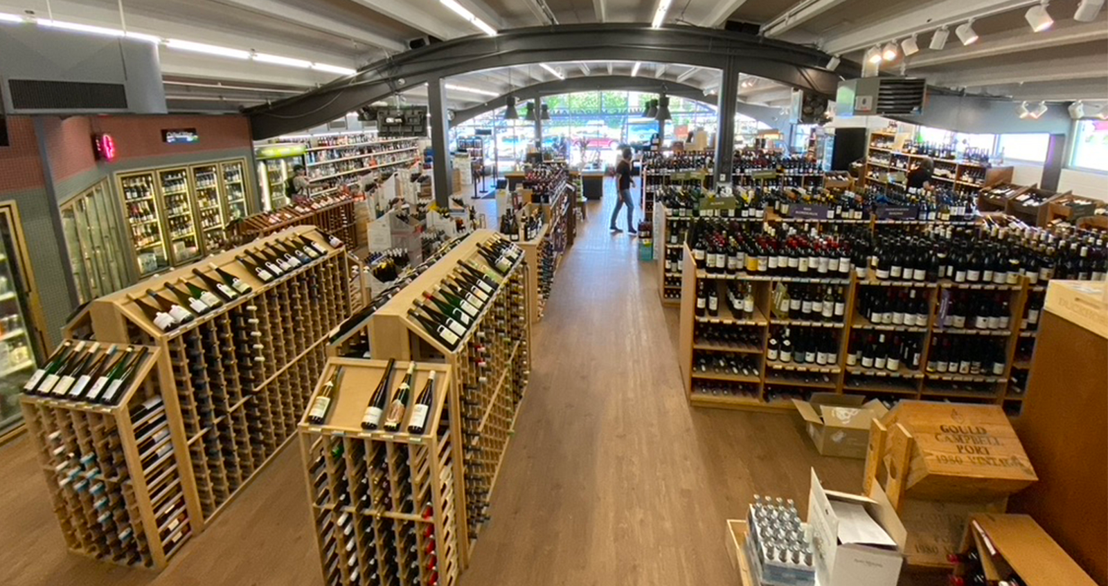 Inside Boulder Wine Merchant — wine shop interior with curved arched ceiling and curated cellar racks in North Boulder, Colorado